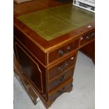 A modern yew wood double pedestal desk