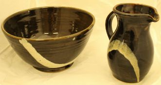 John Bedding Studio Pottery bowl and jug finished in a dark treacle ground with white curved