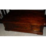 A modern Indian hardwood coffee table with side drawers