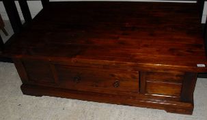 A modern Indian hardwood coffee table with side drawers