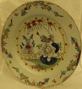 A late 17th or early 18th Century Dutch polychrome Delft charger,
