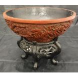 A 19th Century Chinese cinnabar lacquered bowl, decorated in relief with five toed air dragons,