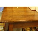 A modern farmhouse style kitchen table with plank top over an end drawer and dummy side drawer in