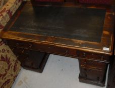 A Victorian mahogany double pedestal desk with three frieze drawers over two banks of three drawers,