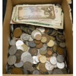A box containing various World coinage and bank notes
