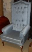 A 20th Century blue buttoned upholstered scroll arm throne chair on cabriole legs to pad feet