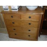 A Victorian satin walnut chest of two short over three long drawers