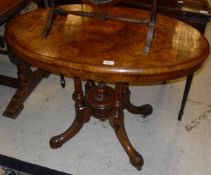 A Victorian burr walnut centre table with oval top on quadruped base and an Edwardian mahogany oval