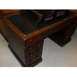 A Victorian mahogany pedestal desk with green leather inset top over nine assorted drawers,