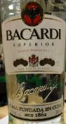 Three bottles Bacardi Rum 100 cl, one bottle Bacardi 70 cl, one bottle Bacardi 35 cl,