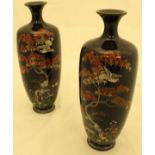 A pair of Japanese Meiji period cloisonné vases decorated with birds amongst maple and blossom