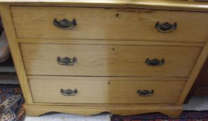 A Victorian ash chest of three long drawers