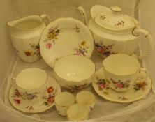 A Royal Crown Derby part tea wares decorated on white ground with floral sprays,