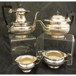 A late Victorian plated four piece tea set by Henry Hobson & Sons with semi reeded decoration and