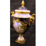 A Coalport twin-handled lidded vase, a cobalt blue ground with gilt highlights,