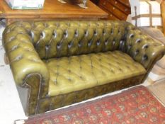 A 20th Century green buttoned leather upholstered Chesterfield sofa CONDITION REPORTS