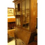 A circa 1900 oak bureau bookcase and an Edwardian mahogany three tier cake stand