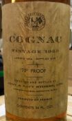 Two bottles Army and Navy Stores Limited Cognac Vintage 1953, landed 1954,