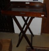 A 19th Century mahogany butler's tray on folding stand