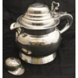 An 18th Century plated lidded jug with open work thumb piece bearing George II plated copper coin