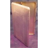 A George VI silver cigarette case of rectangular form with engine turned decoration and gilt washed