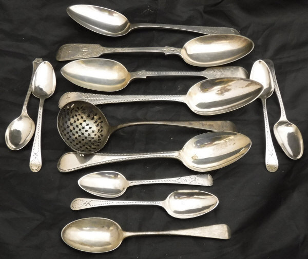 A silver sifter spoon with pierced bowl, marks obscured,