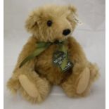 A Steiff Harrods musical bear, limited edition, gold plush with boot button eyes,