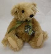 A Steiff Harrods musical bear, limited edition, gold plush with boot button eyes,
