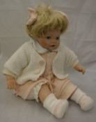 A 20th Century porcelain doll,