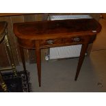 A walnut and cross-banded demi-lune single drawer side table in the 19th Century manner