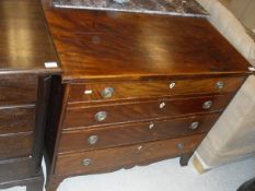 A Regency mahogany and inlaid square front chest of four long graduated drawers with ivory shield