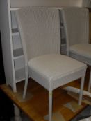 A set of six modern Lloyd Loom painted dining chairs,