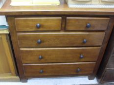 A modern oak chest of four long drawers and a modern pot cupboard