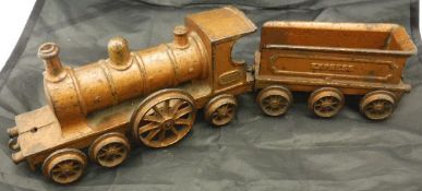A gold-painted cast iron toy / floor train inscribed "Wallwork's Patent", No'd.