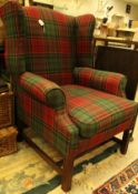 A modern tartan upholstered wing back scroll arm chair in the Georgian manner