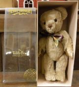 A Merrythought limited edition millennium bear, mohair with jointed arms and glass eyes,