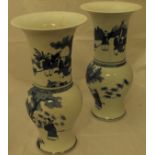 A matched pair of blue and white Chinese baluster shaped vases with flared rims,