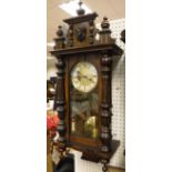 A mahogany cased Vienna wall clock with Roman numerals to the dial