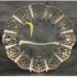 A George V silver fruit dish with lobed pierced foliate decoration raised on a circular foot (by