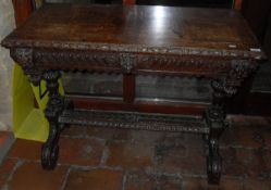 A Victorian carved oak Gothic Revival centre table,