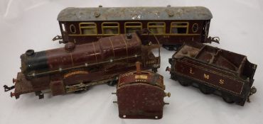 A collection of Hornby 0 gauge railwayana including Royal Scot 1-0-0 loco and tender in LMS livery,