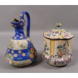 An Amphora conical ewer in Art Nouveau taste with stylised roses and daisies on a blue ground,