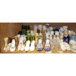 An extensive collection of ceramic and glass shoes, mainly 19th century,