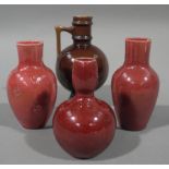 A Burmantofts globular vase with brown glaze and angular handle 16cm,