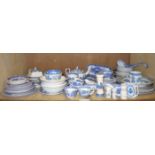 A large quantity of blue and white printed pottery, principally Willow Pattern,