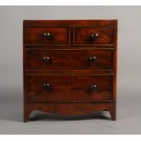 A 19TH CENTURY MAHOGANY SPECIMEN BOW FRONTED CHEST of two short and two graduated drawers,
