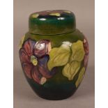 A MOORCROFT POTTERY 'CLEMATIS' GINGER JAR AND COVER,