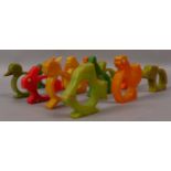 A SET OF THIRTEEN ART DECO BAKELITE NAPKIN RINGS in the shape of animals to include rabbits, hens,