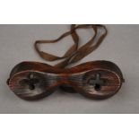 A PAIR OF INUIT-TYPE WOODEN SNOW GOGGLES with cross-shaped eye slits used by Thomas Soulsby