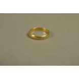 A wedding ring in 22ct gold,